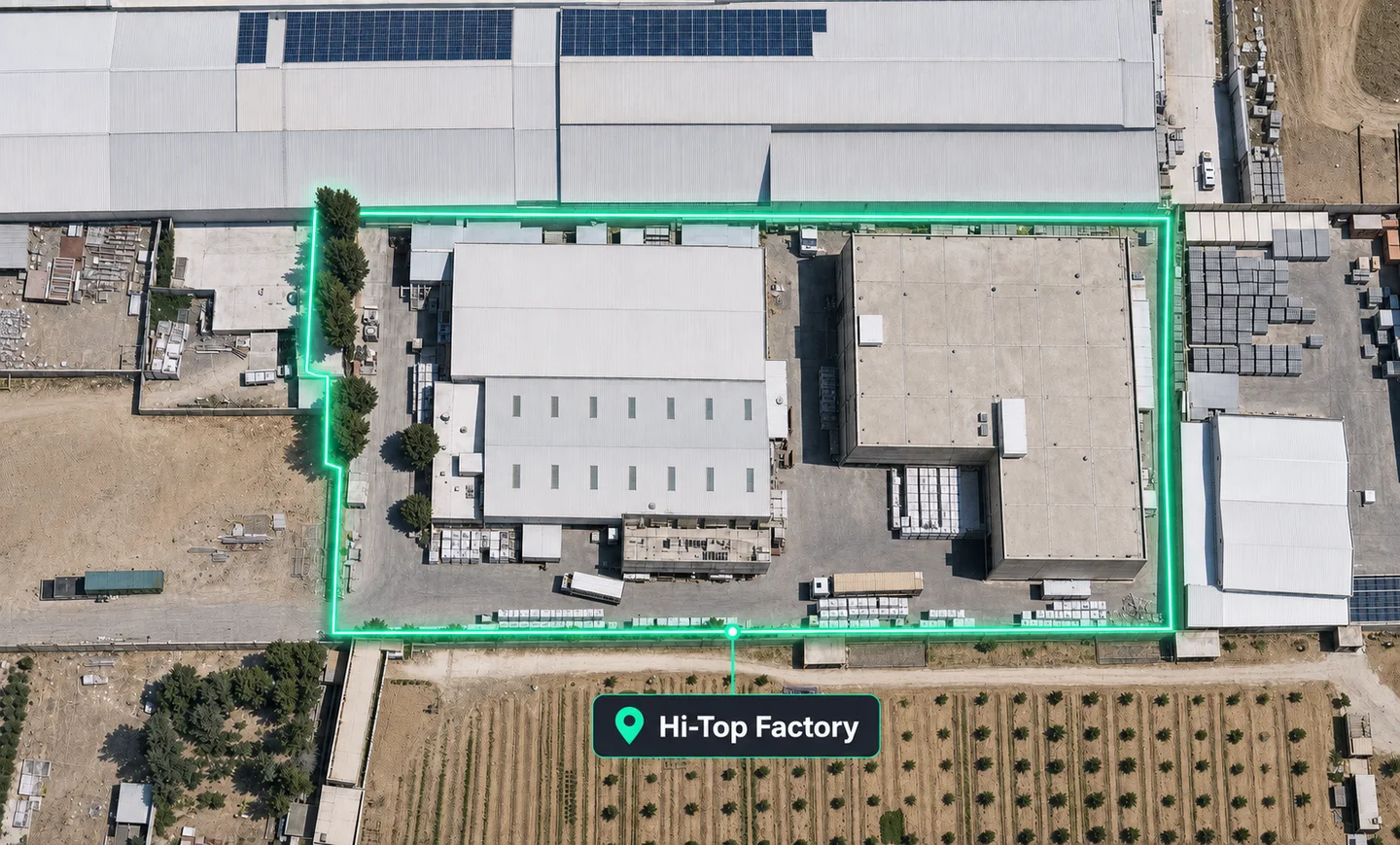 Aerial view of the Hi-Top factory in Al-Muwaqqar, the site boundary marked in green.